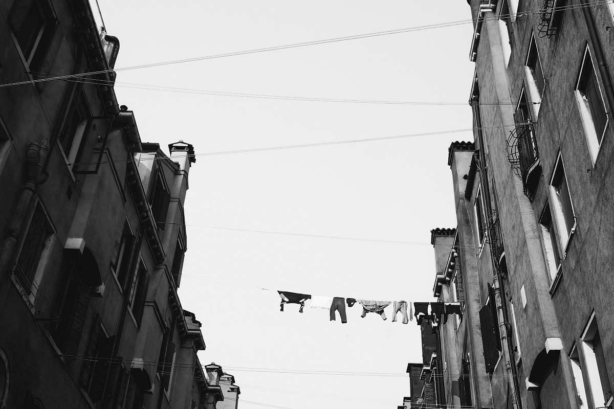 city grayscale low angle photo of concrete buildings urban
