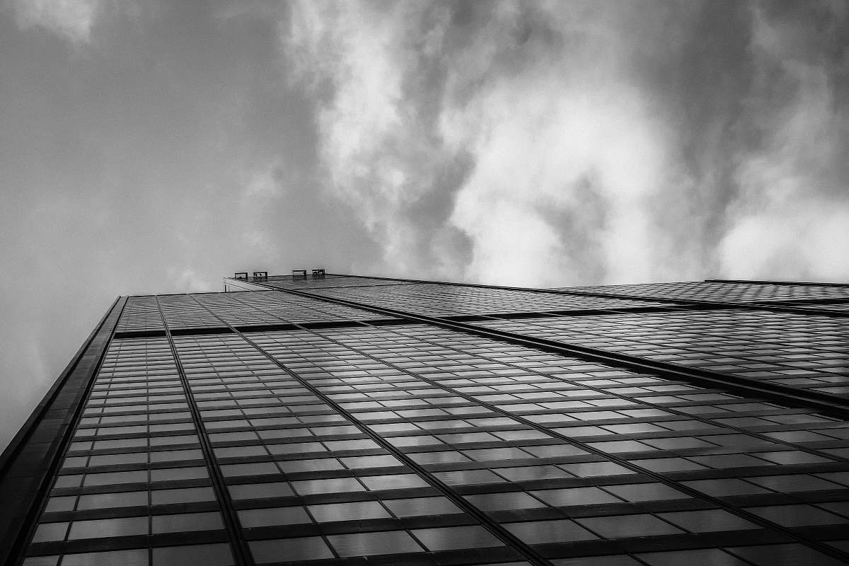 grey grayscale low angle photography of concrete building urban