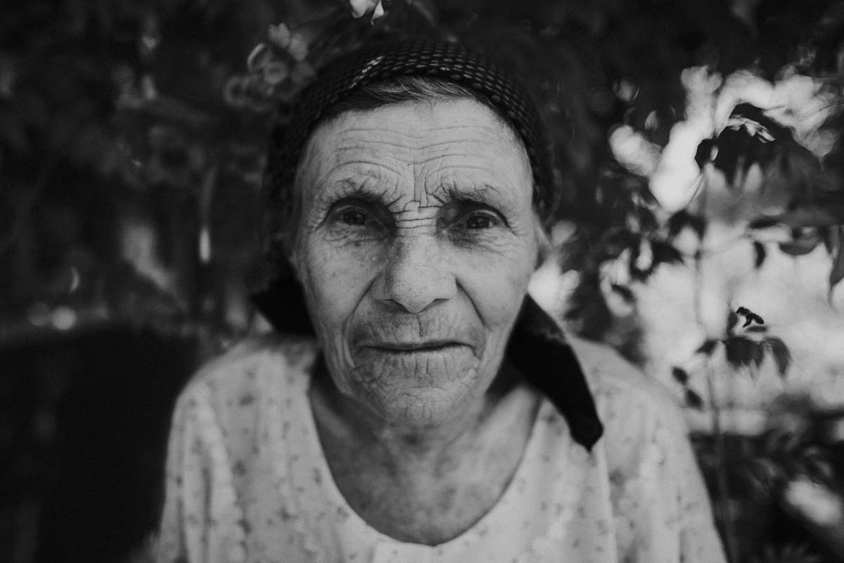 portrait grayscale photo of a woman face