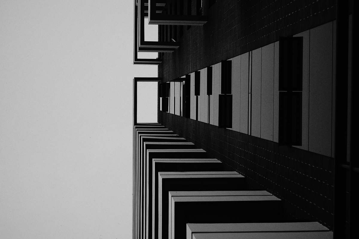 banister grayscale photo of building handrail