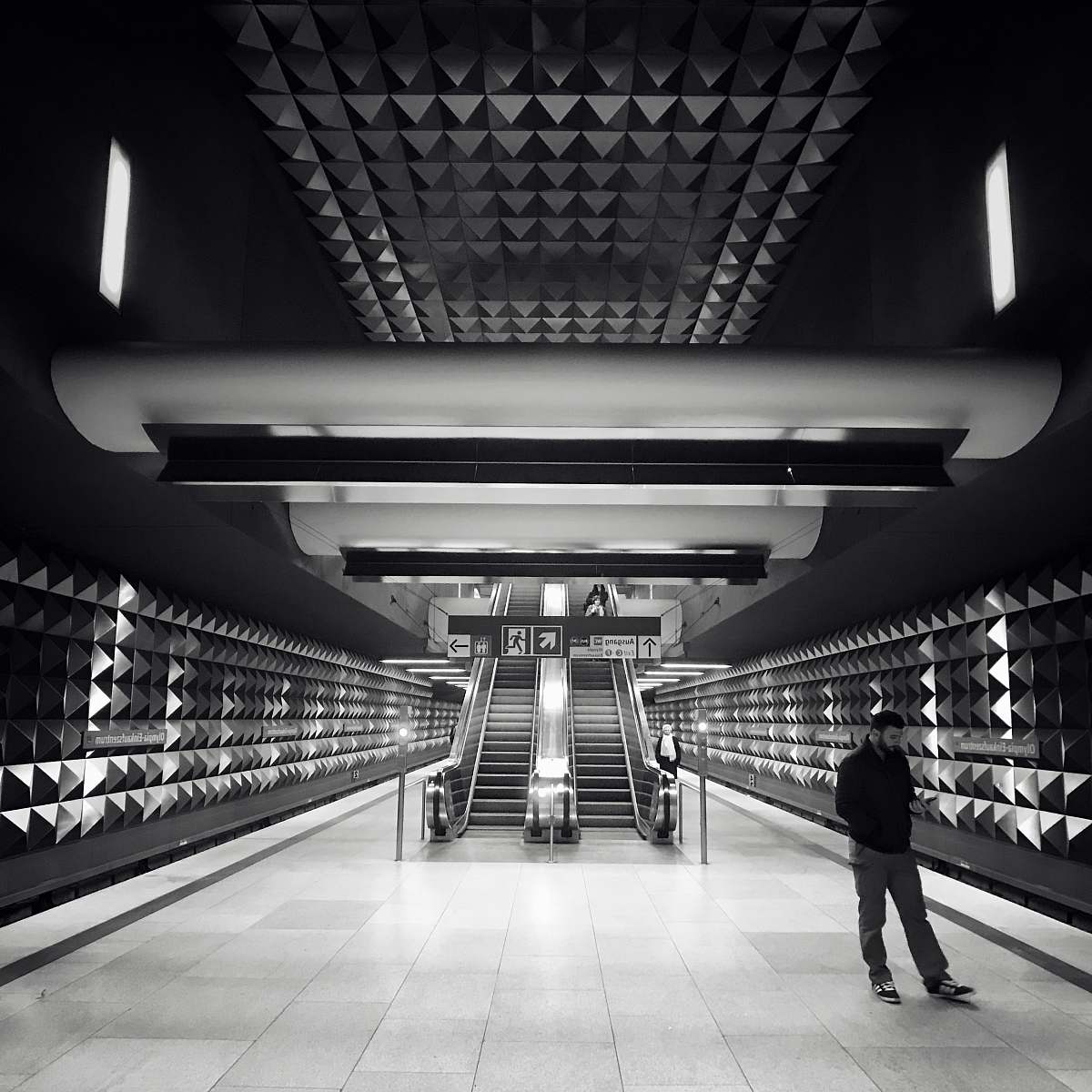 subway grayscale photo of escalator train