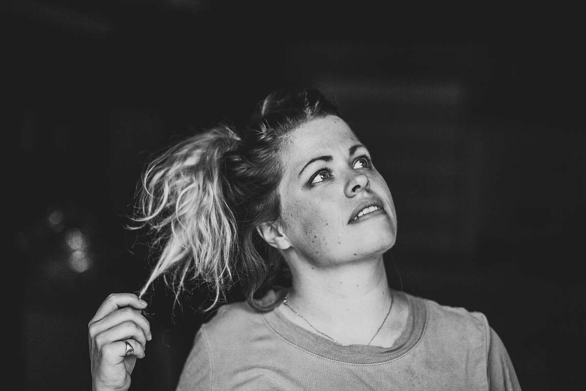 person grayscale photo of gray crew-neck shirt human