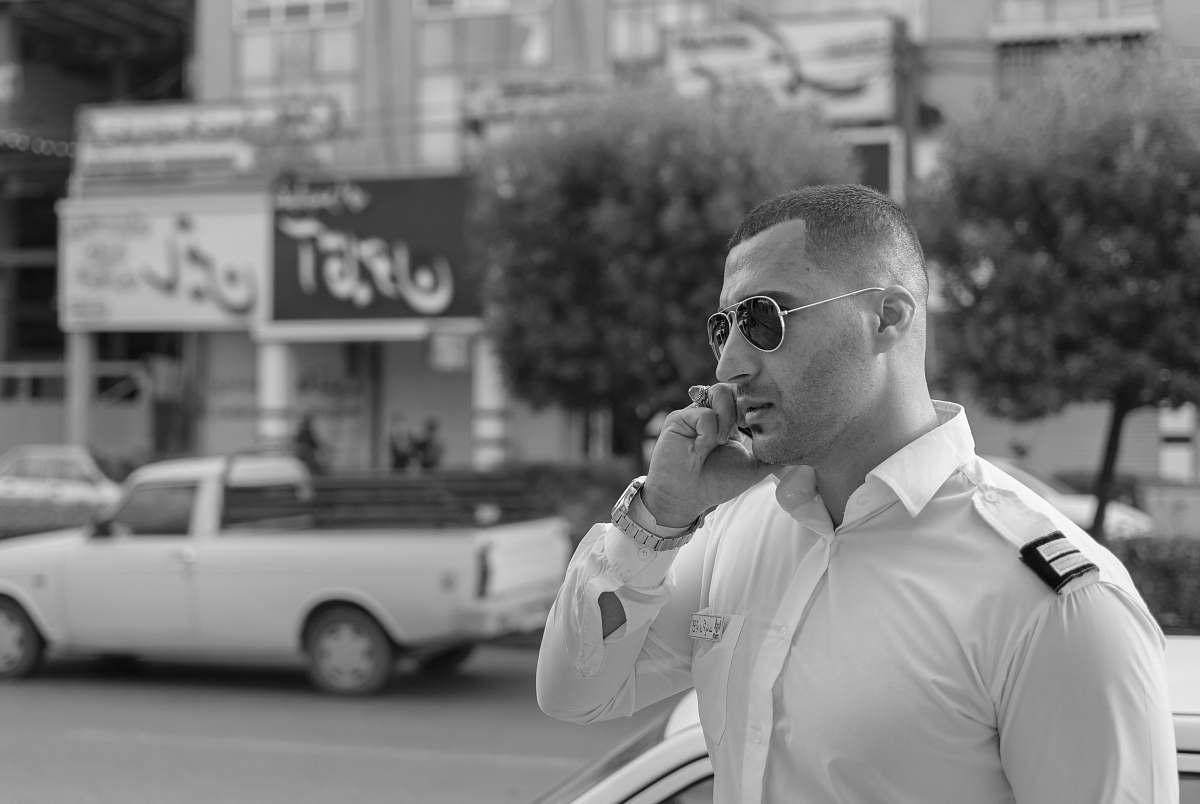 human grayscale photo of man on road person