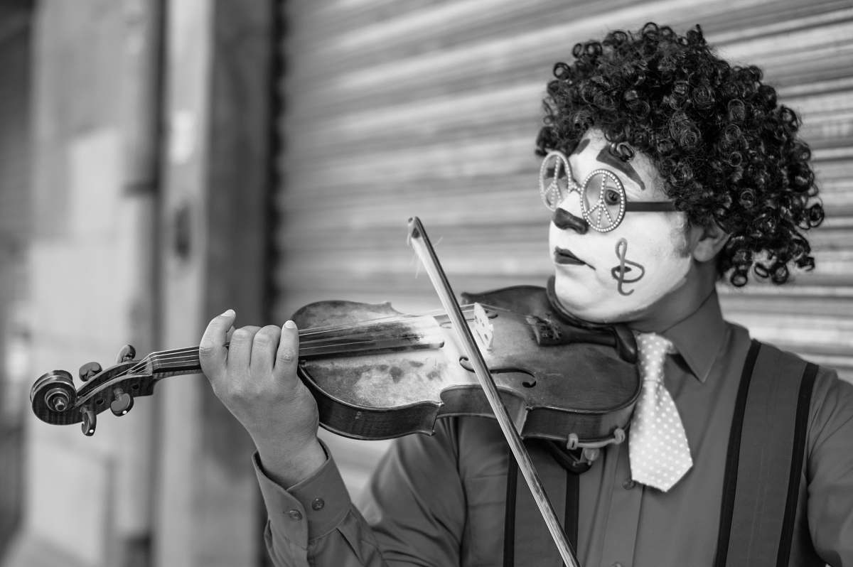 violin grayscale photo of man playing violin music