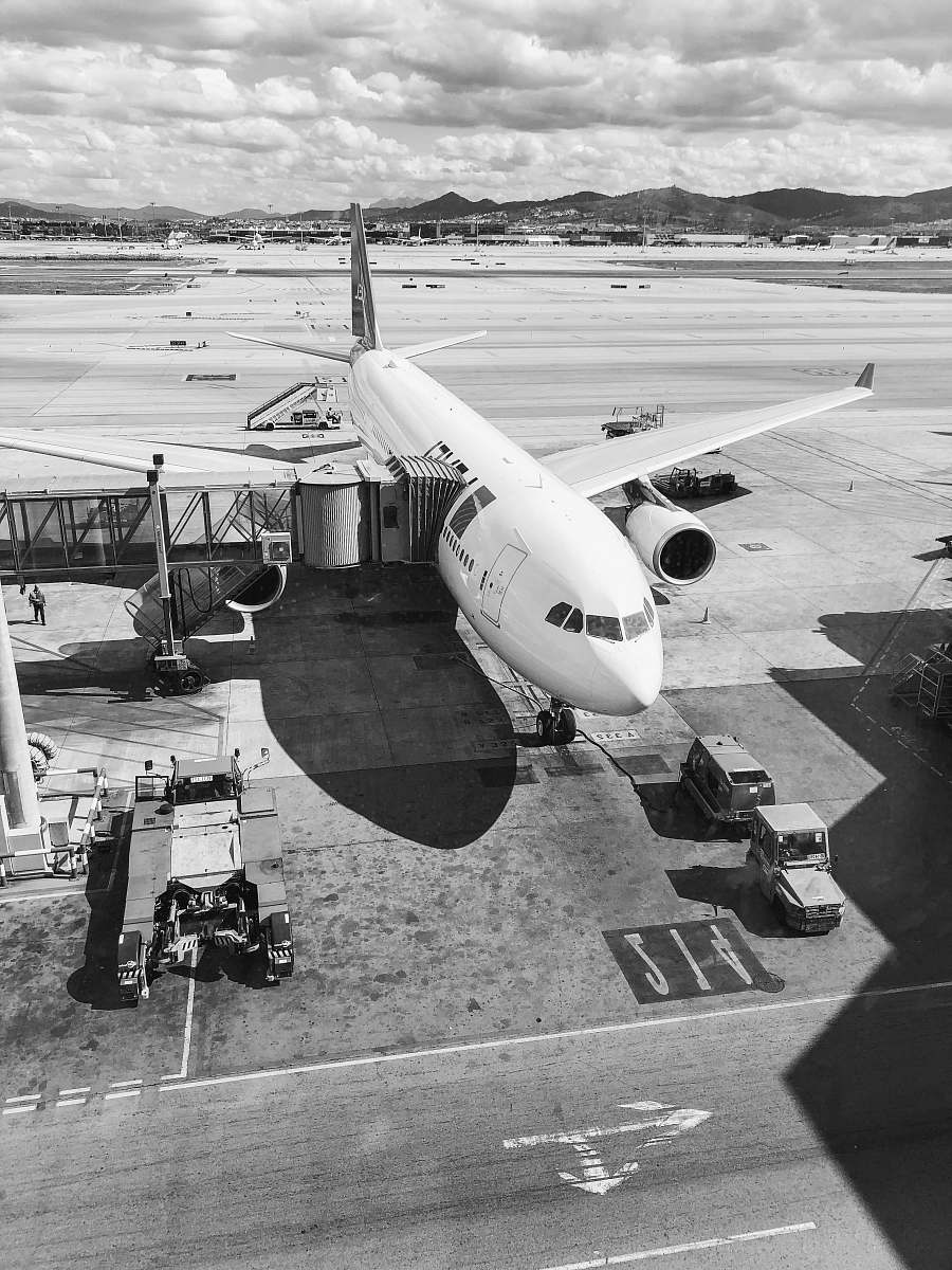 airplane grayscale photo of plane airport