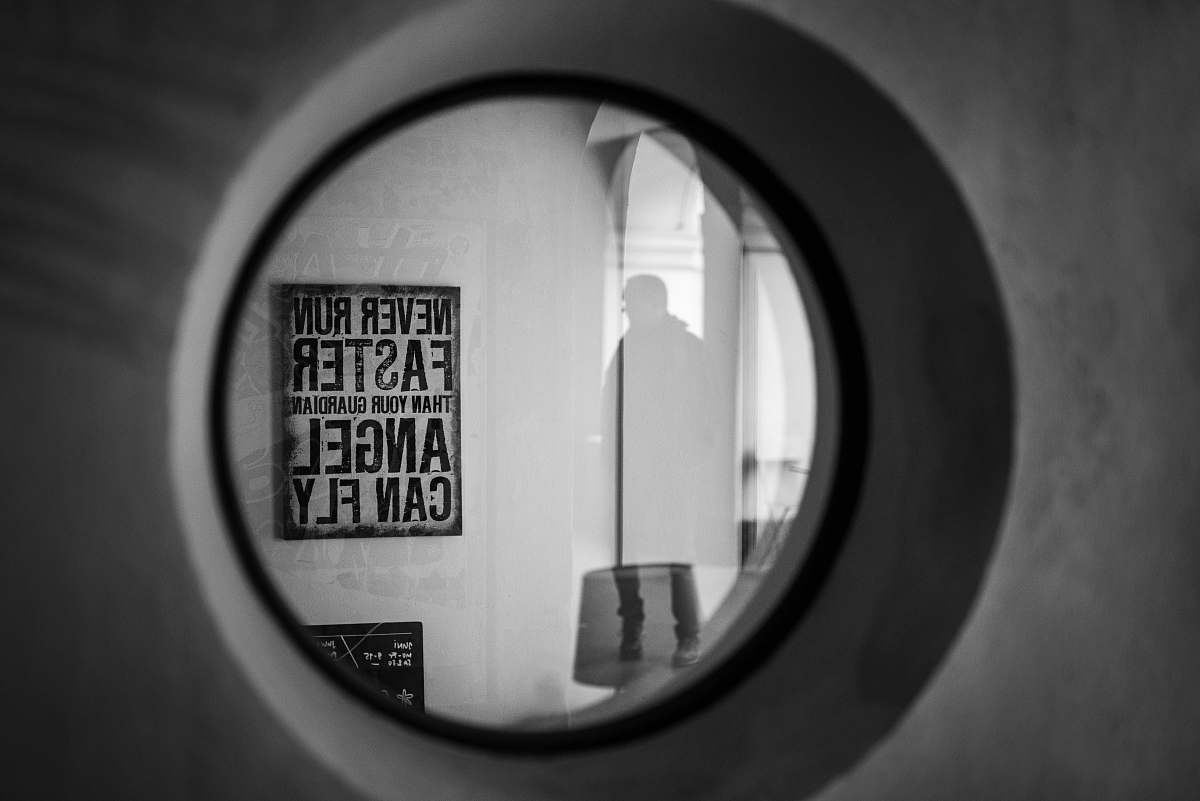 human grayscale photo of round frame person