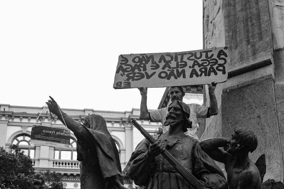 human grayscale photo of statues person