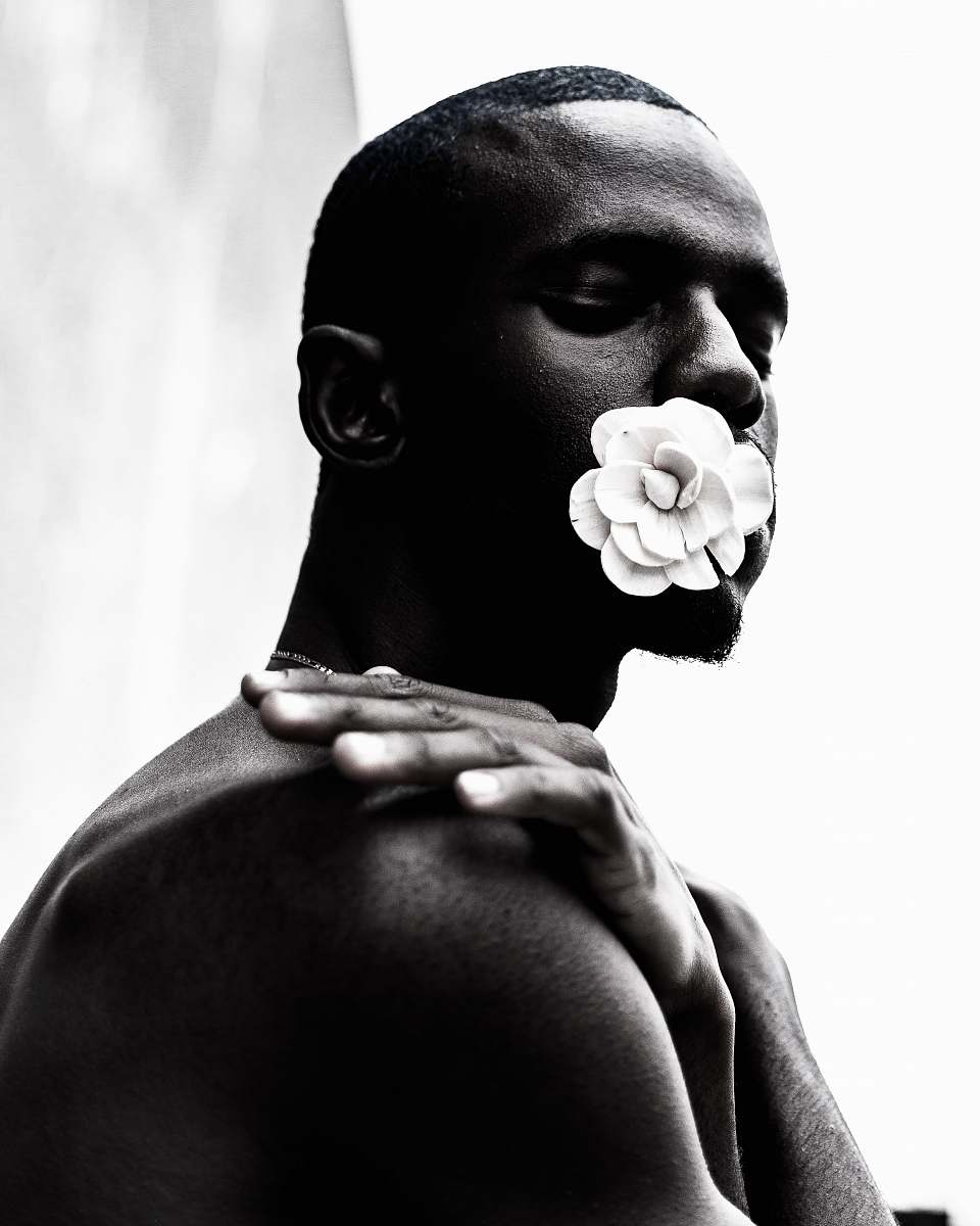 person grayscale photo of topless man human