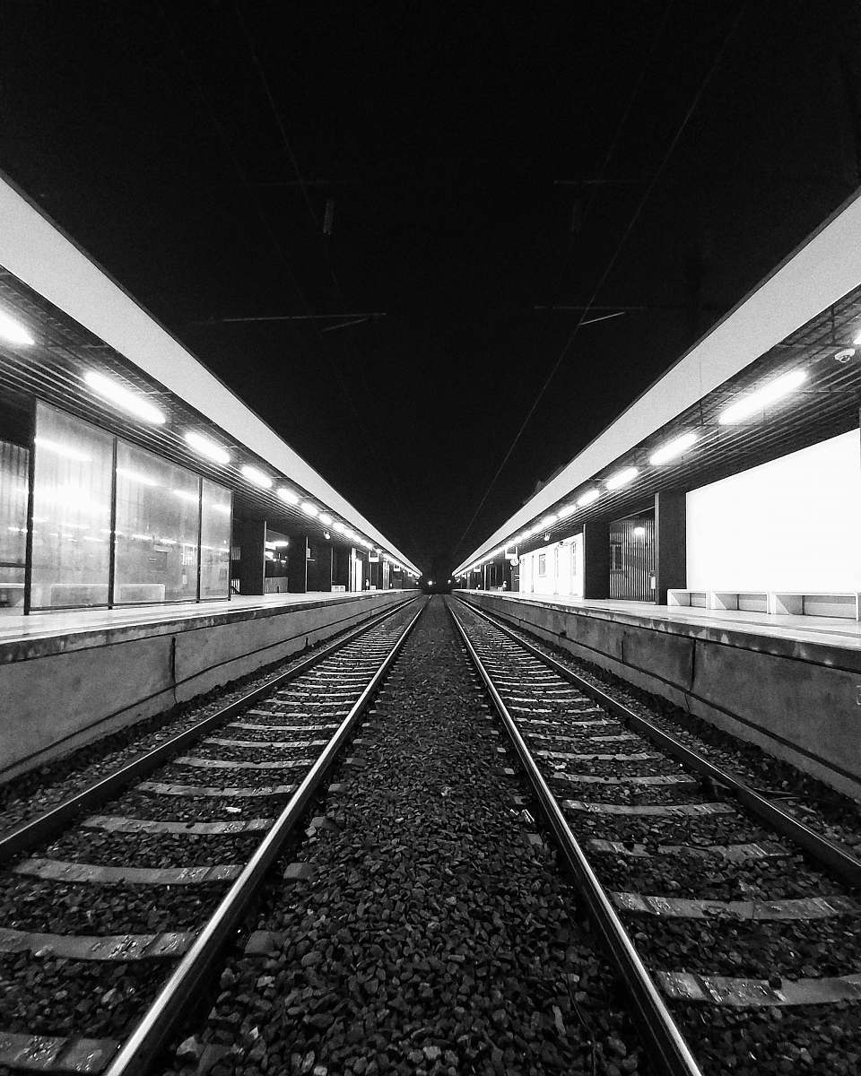 railway grayscale photo of train rails train track