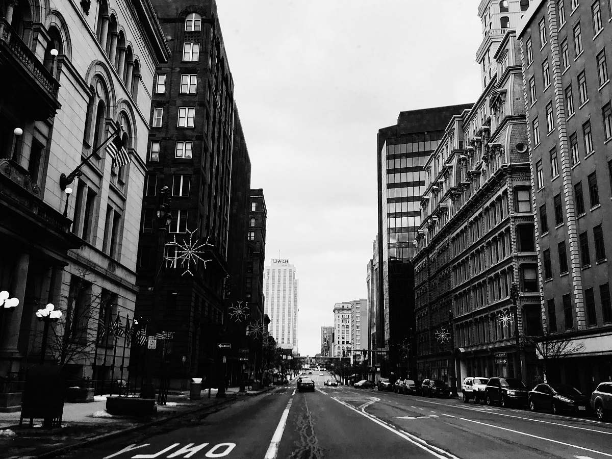 road grayscale photo of vehicles on road asphalt