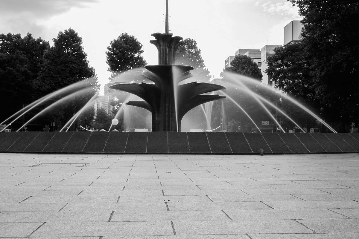 water grayscale photo of water fountain fountain