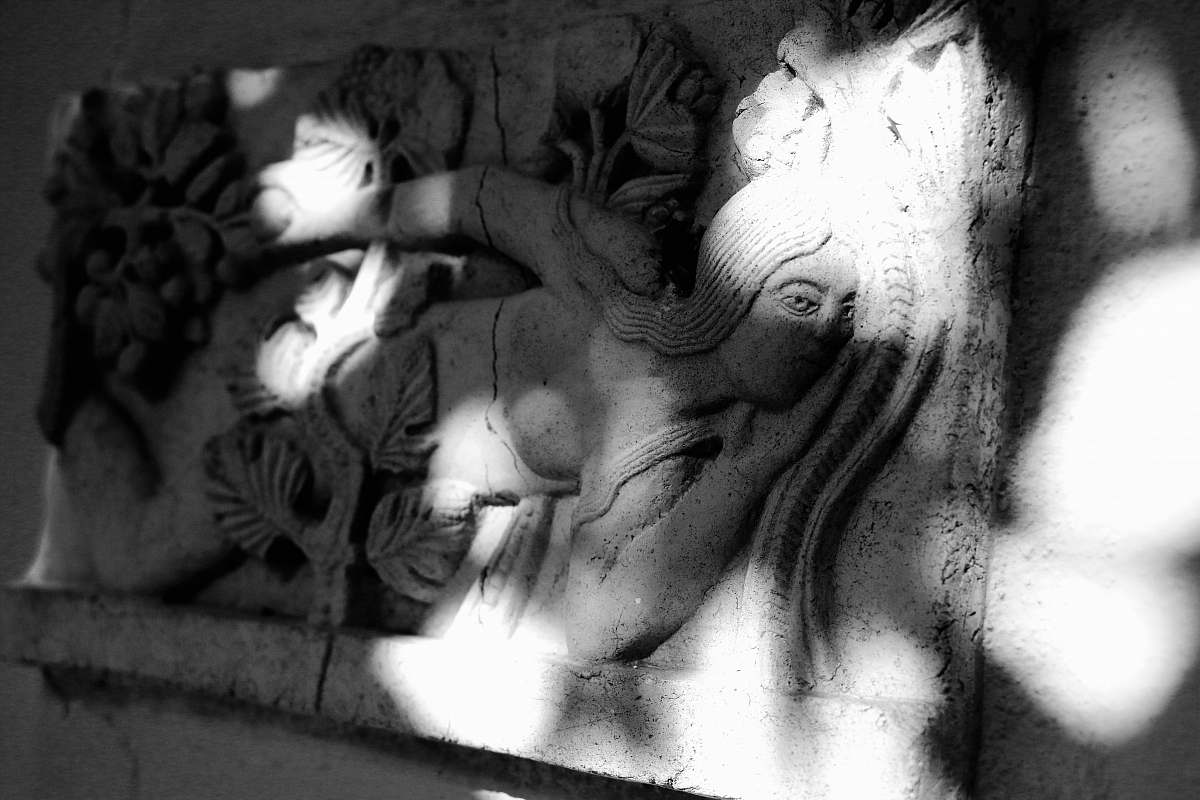 grey grayscale photo of woman embossed wall decor art