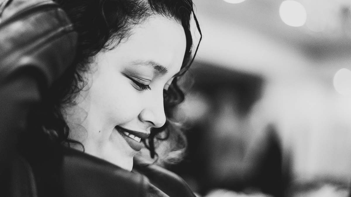 human grayscale photo of woman face person