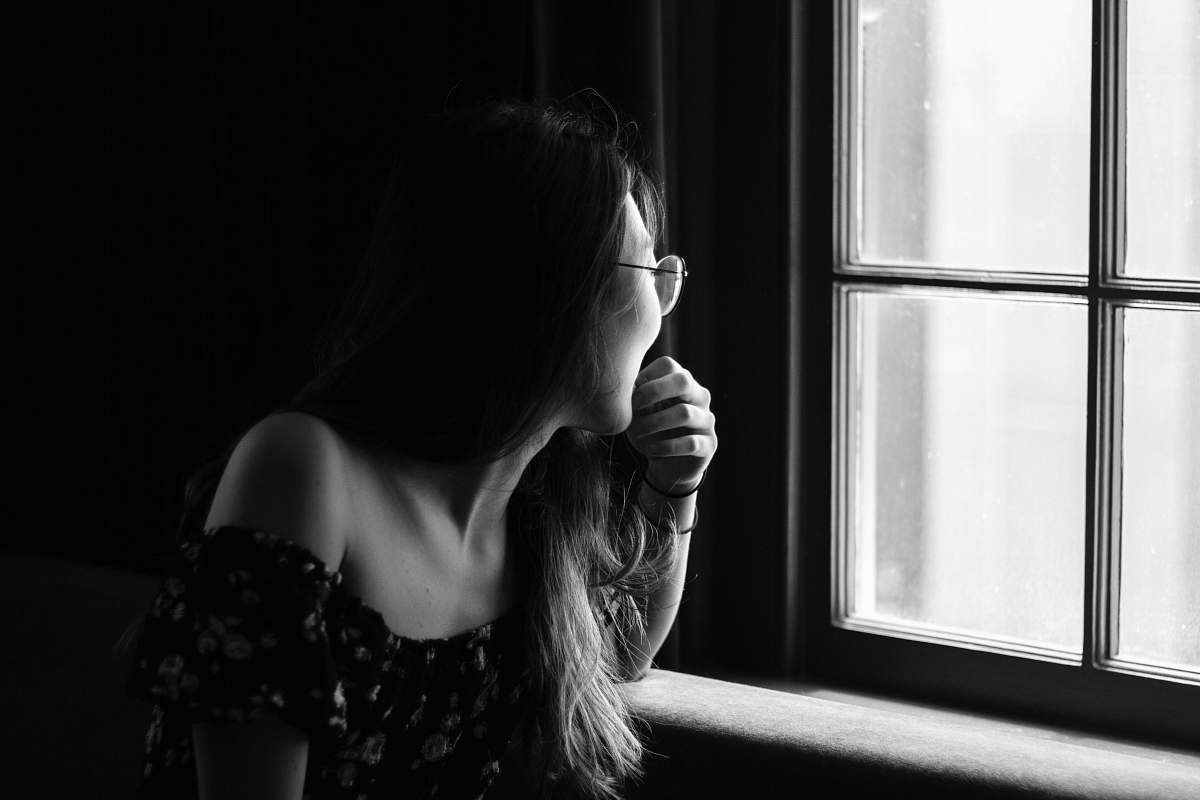person grayscale photo of woman in off-shoulder top human