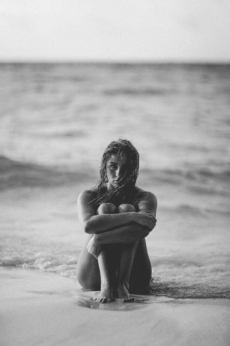 woman grayscale photo of woman on seashore people