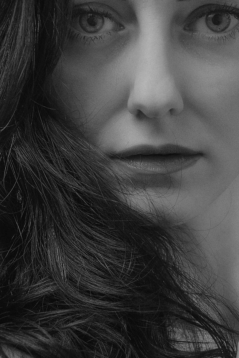 human grayscale photograph of woman face