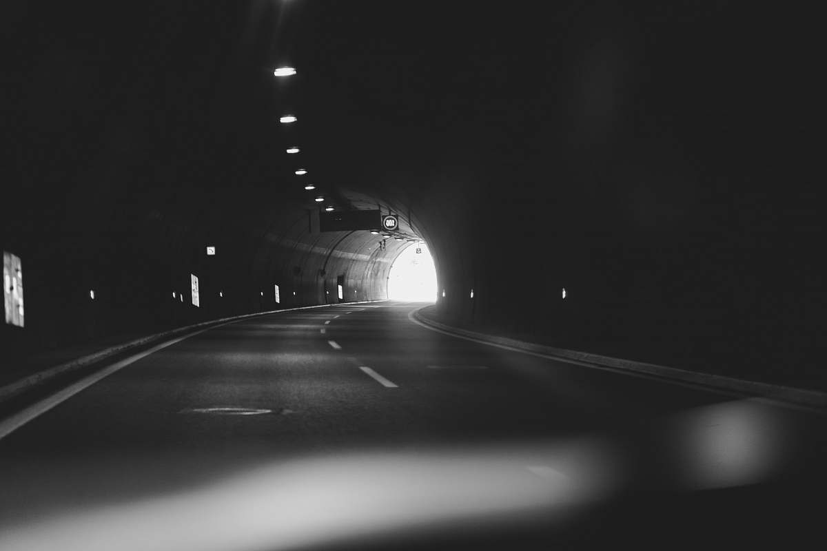 tunnel grayscale photography of a tunnel corfu