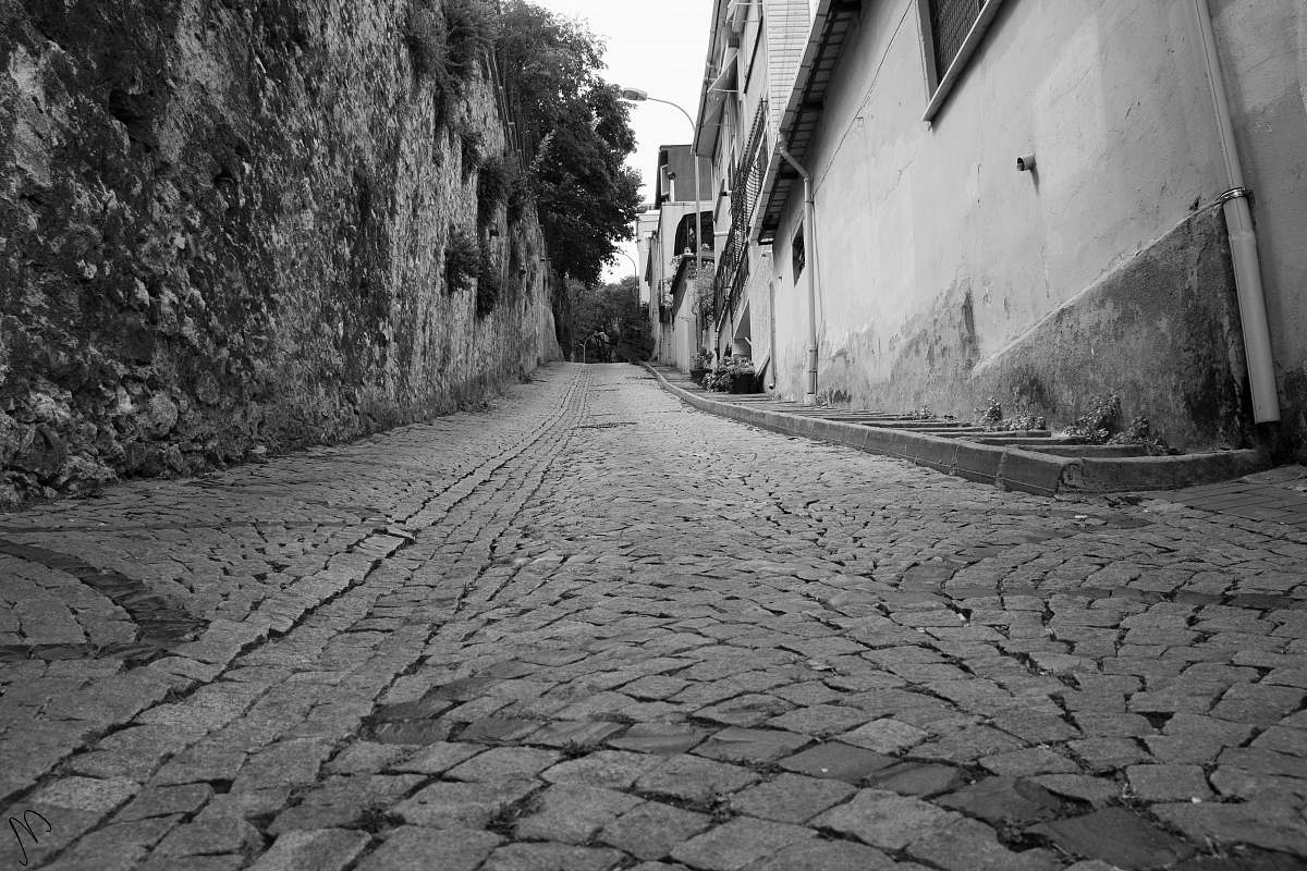 path grayscale photography of alleway walkway