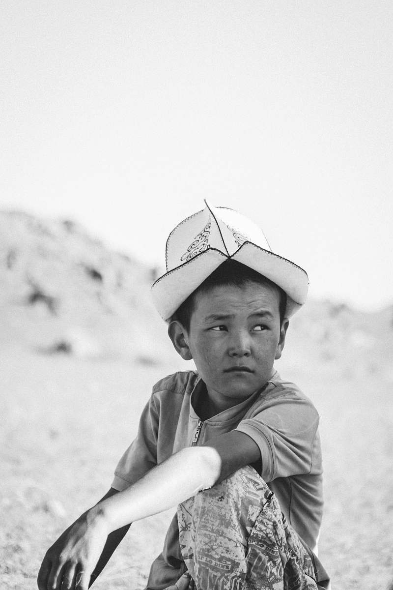human grayscale photography of box with hat people