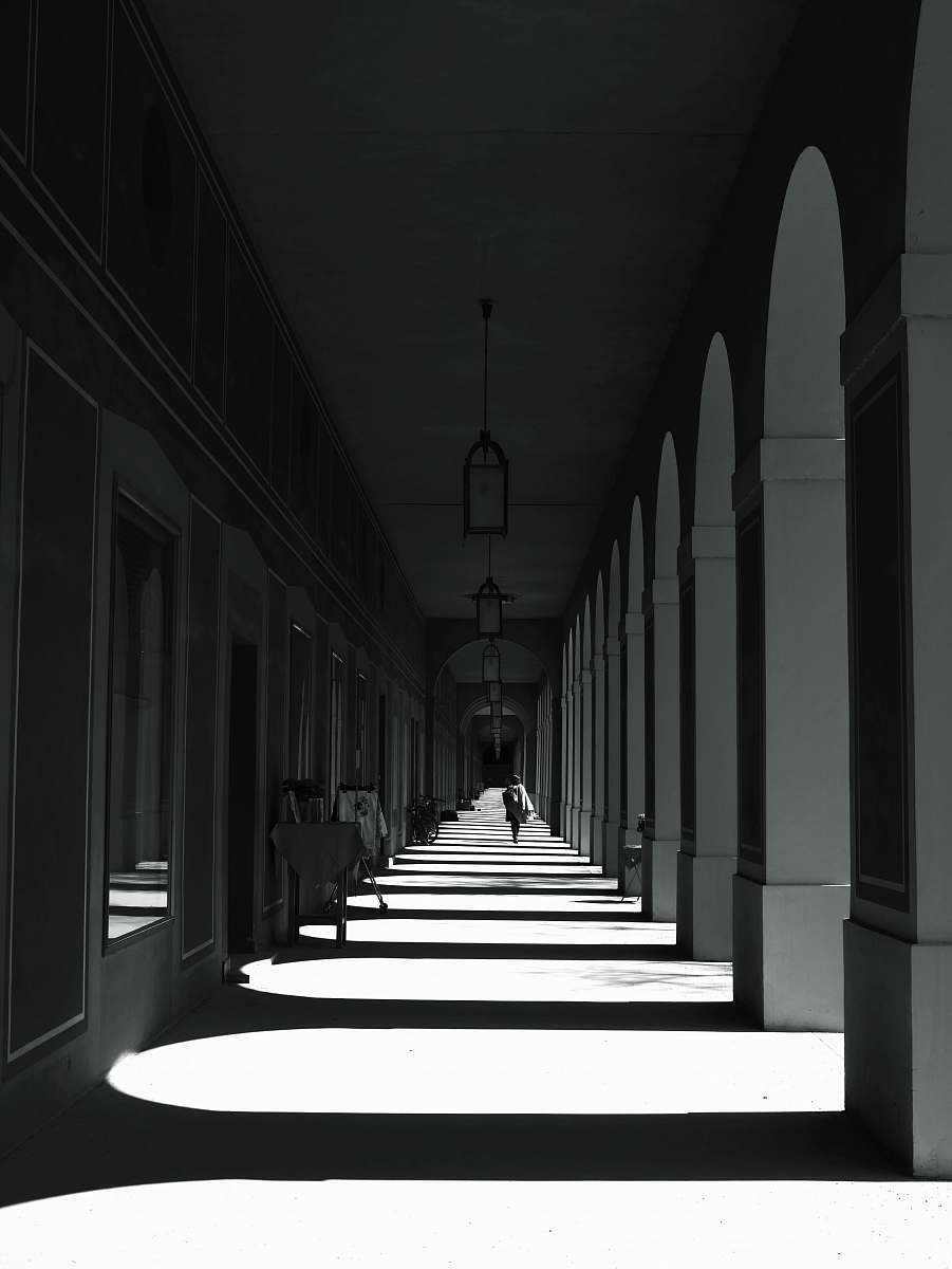 corridor grayscale photography of building floor