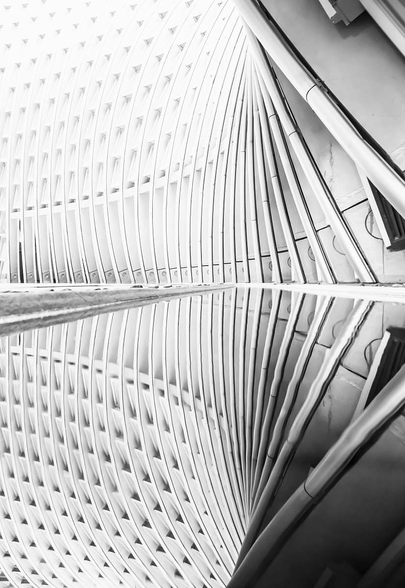building grayscale photography of building interior staircase