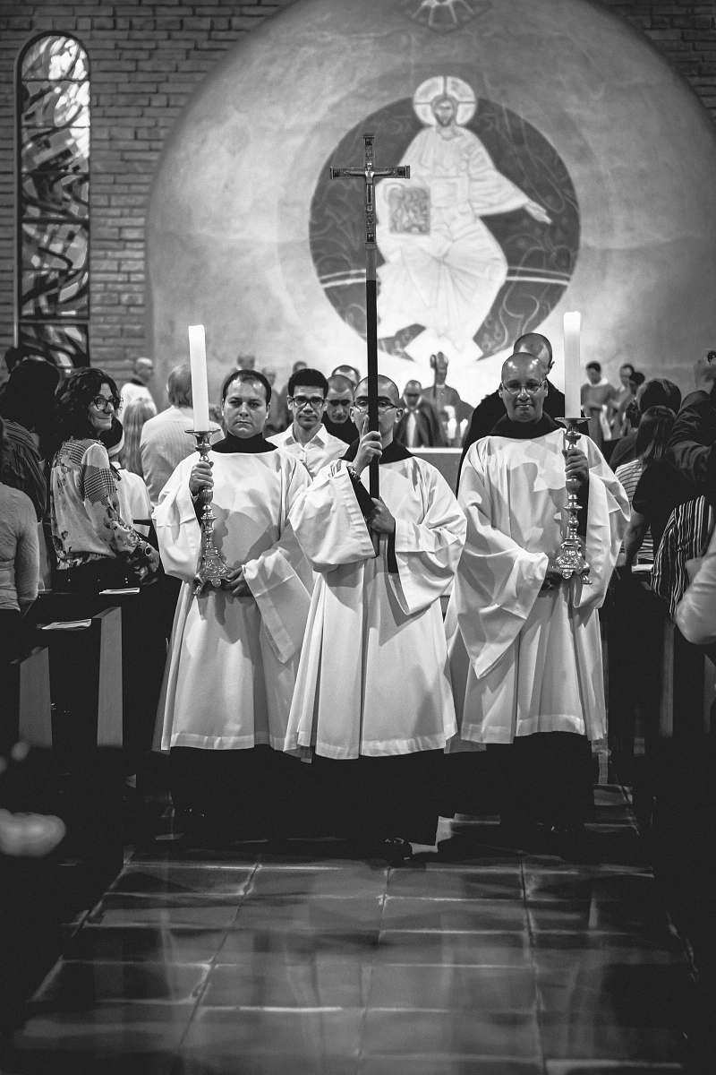 person grayscale photography of church scne human