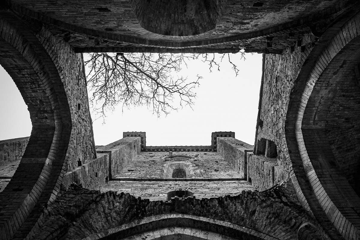 building grayscale photography of concrete building hole