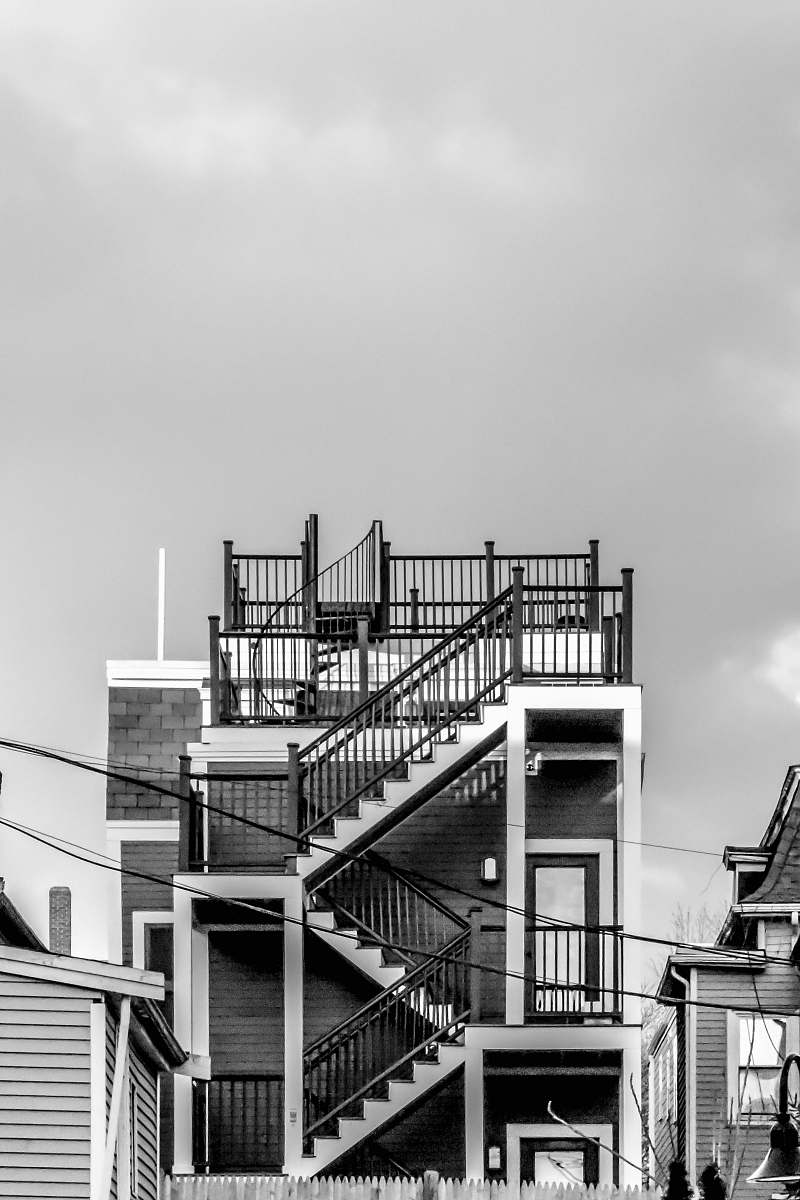 handrail grayscale photography of concrete building banister