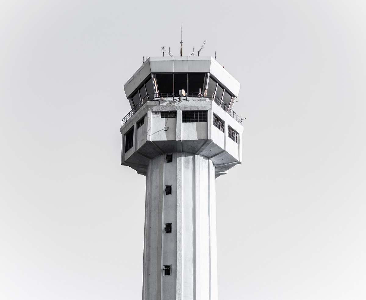 building grayscale photography of concrete tower tower