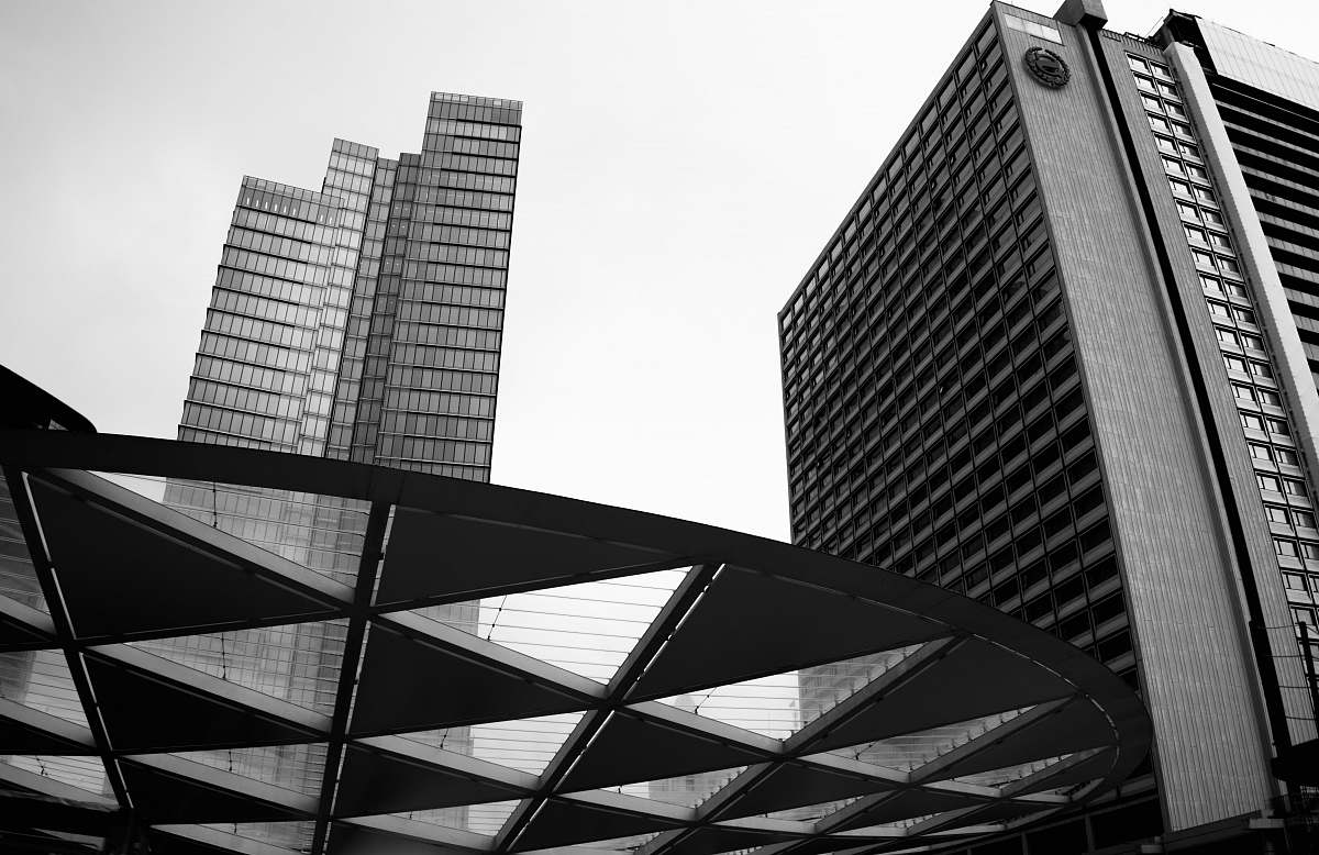 building grayscale photography of curtain building office building
