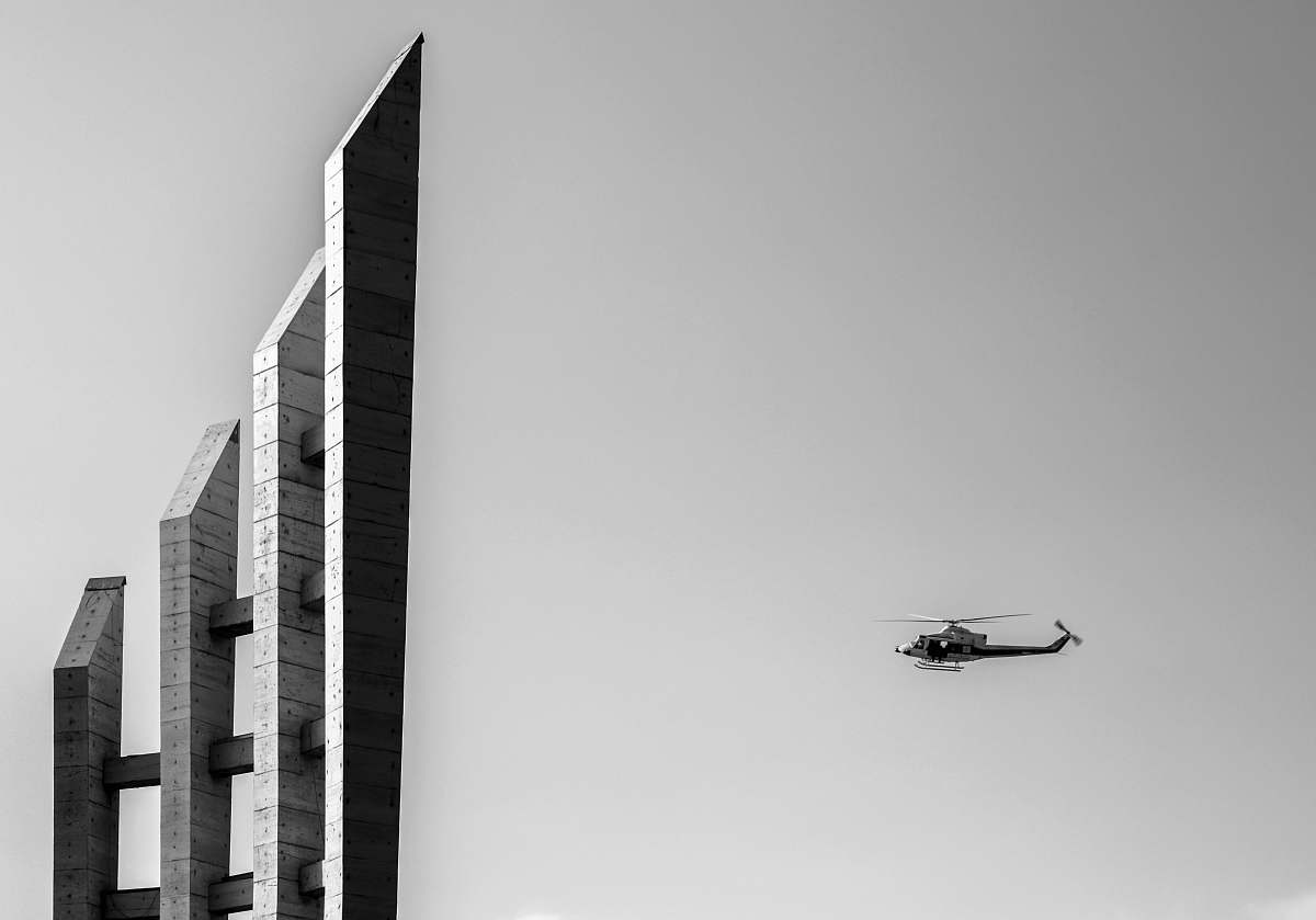 helicopter grayscale photography of helicopter near the building aircraft