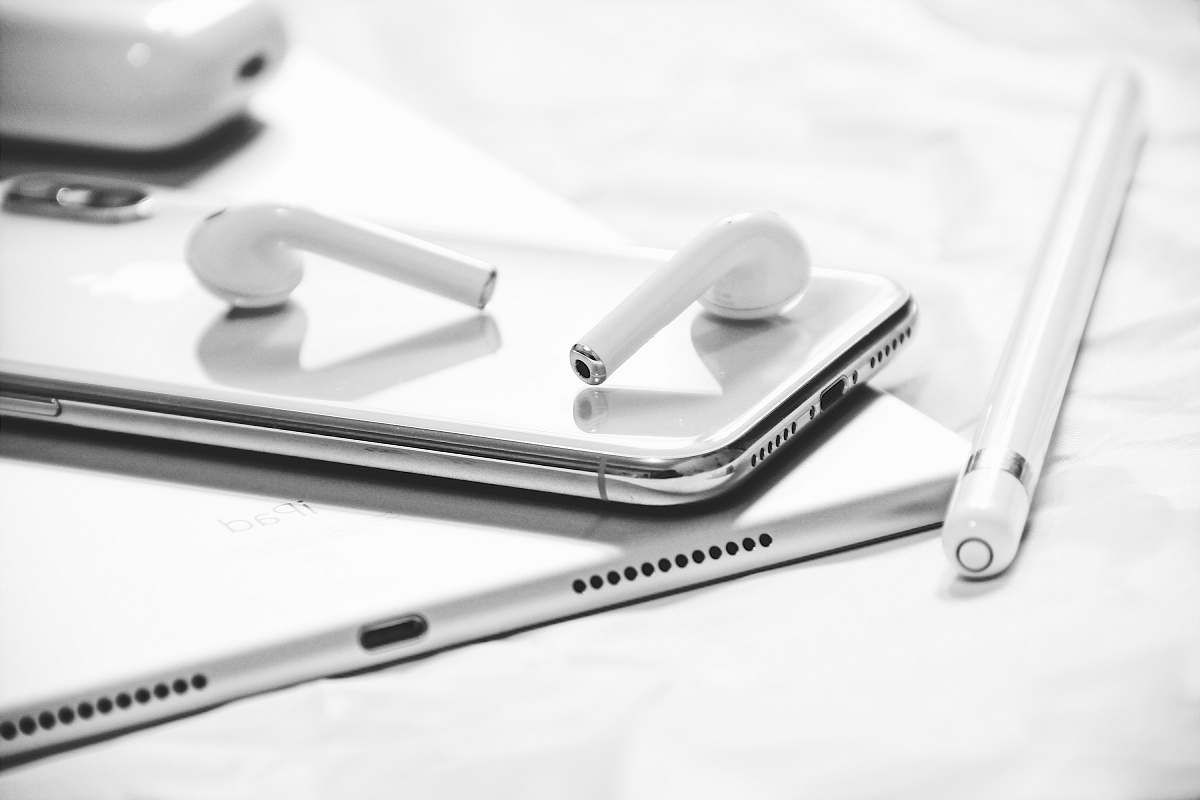 grey grayscale photography of iPhone X, AirPods, Apple Pencil and iPad phone