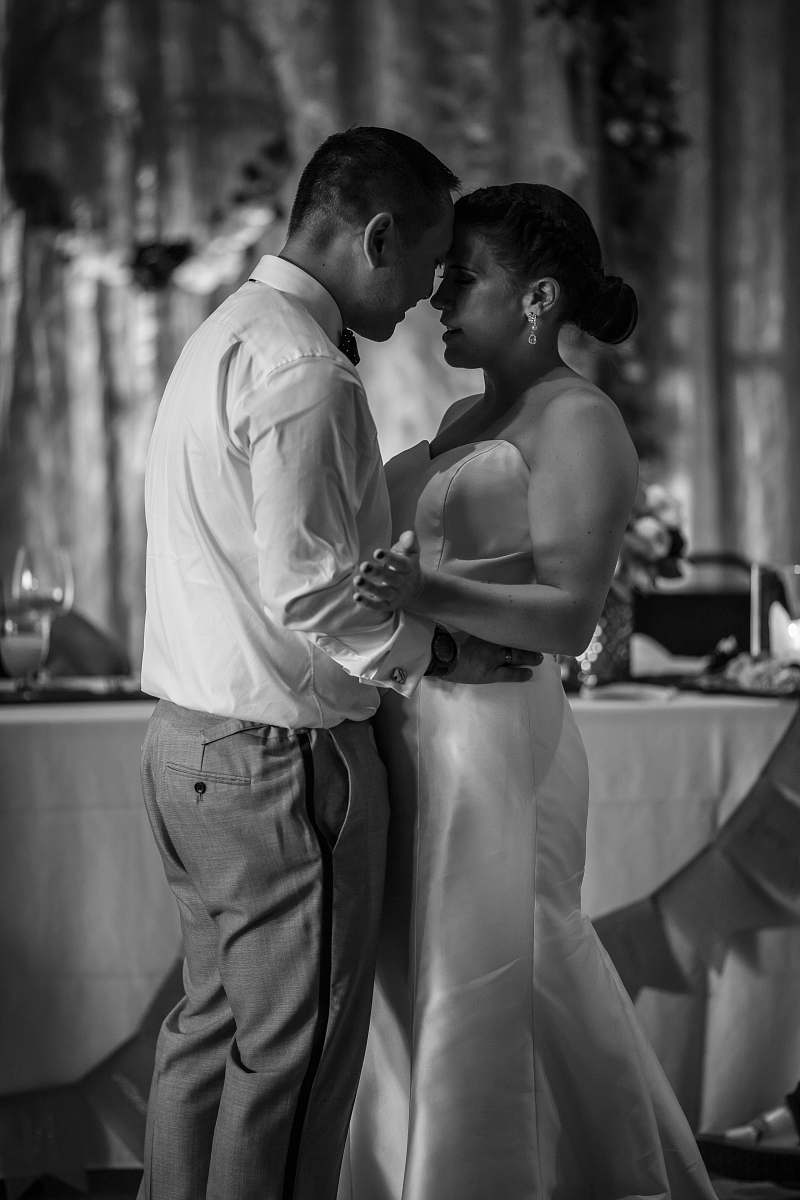 person grayscale photography of man and woman facing each other people