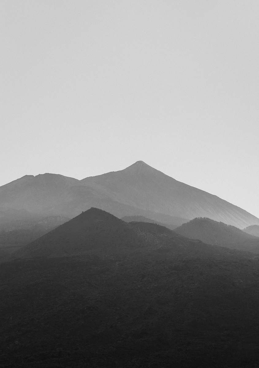 mountain grayscale photography of mountains mountain range