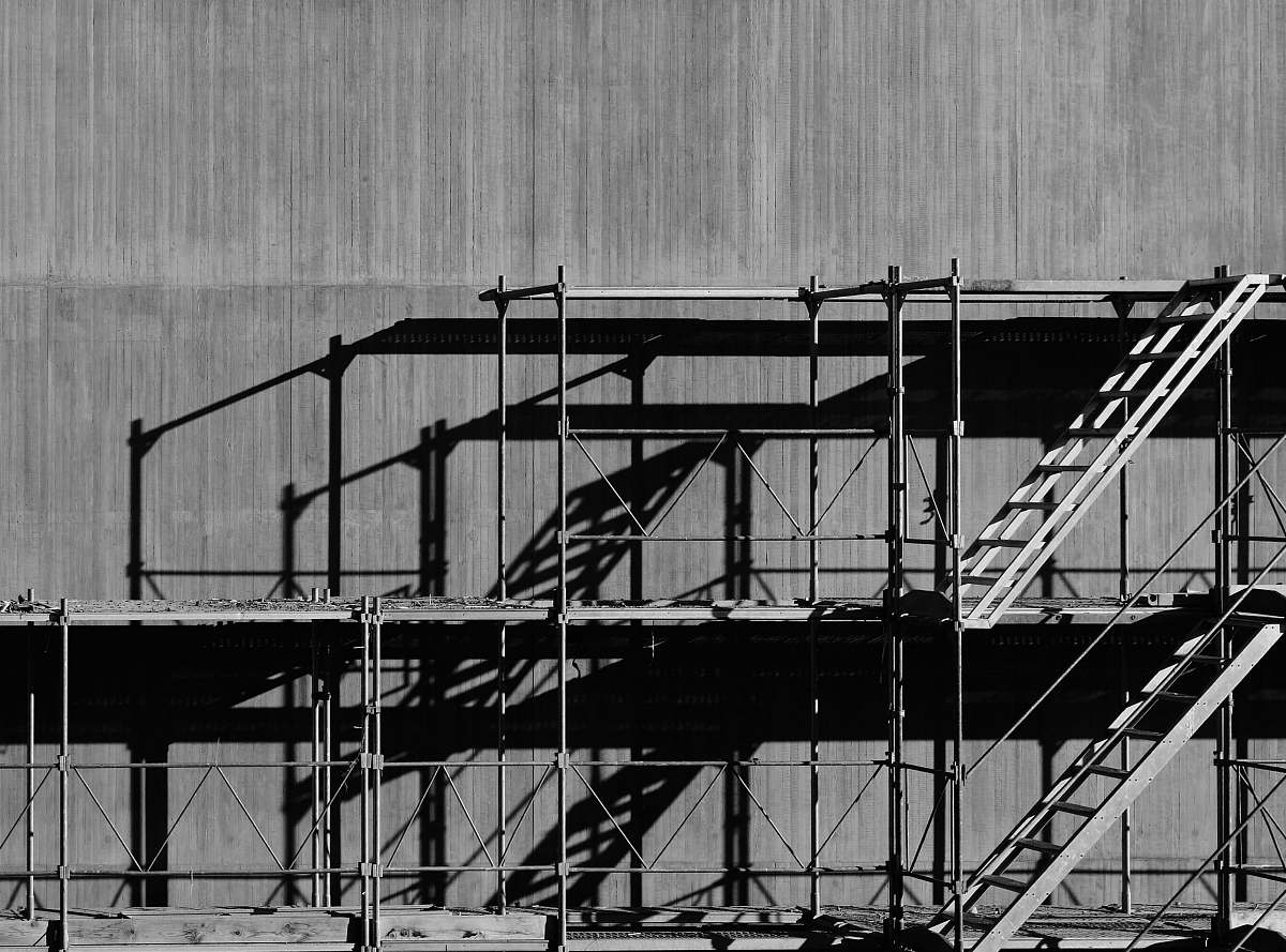 building grayscale photography of piled racks black