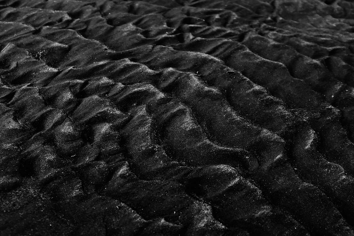 texture grayscale photography of sand karekare