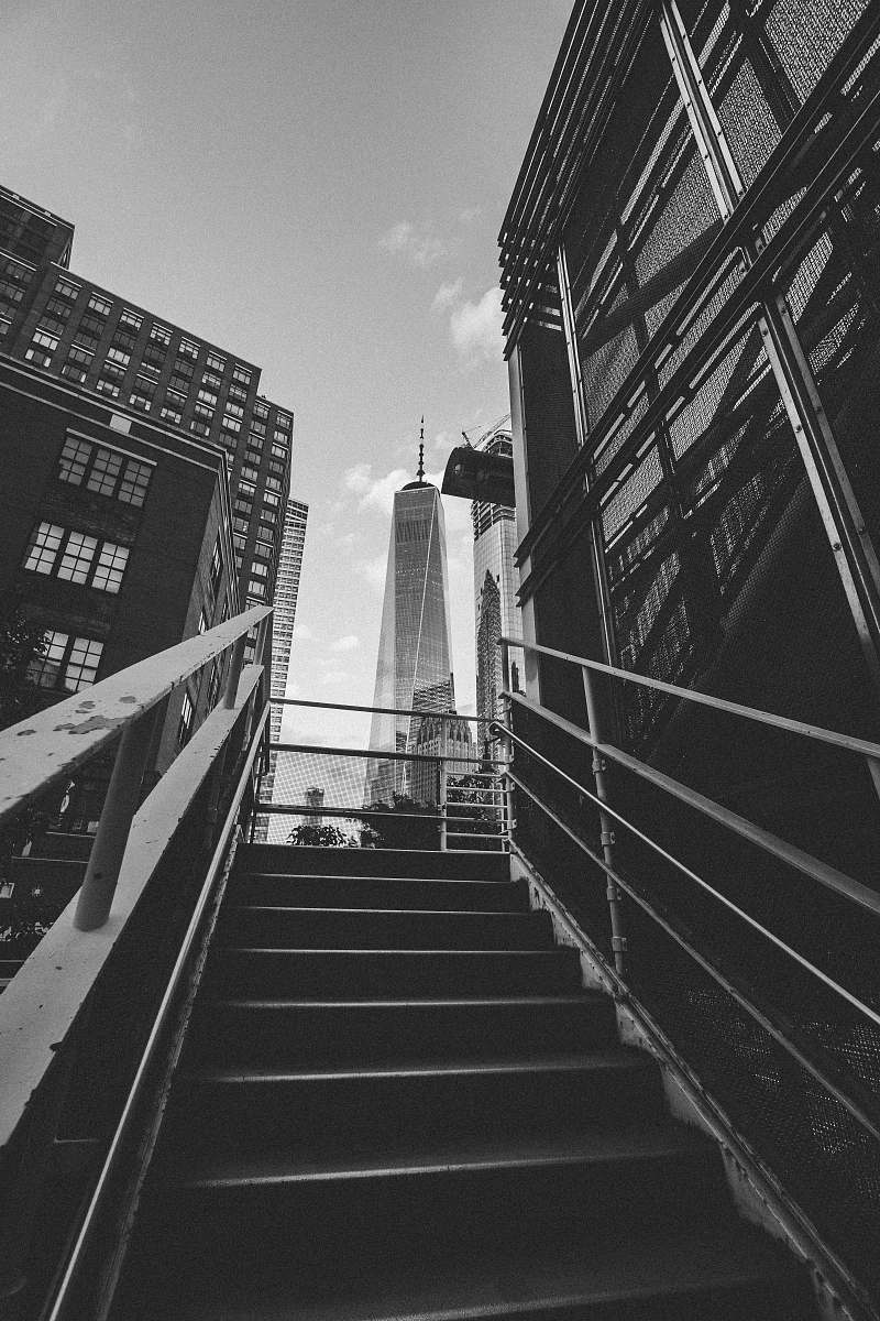 grey grayscale photography of stairway leading to building architecture