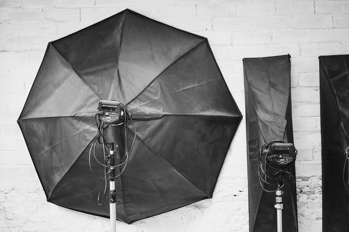 grey grayscale photography of studio lights umbrella