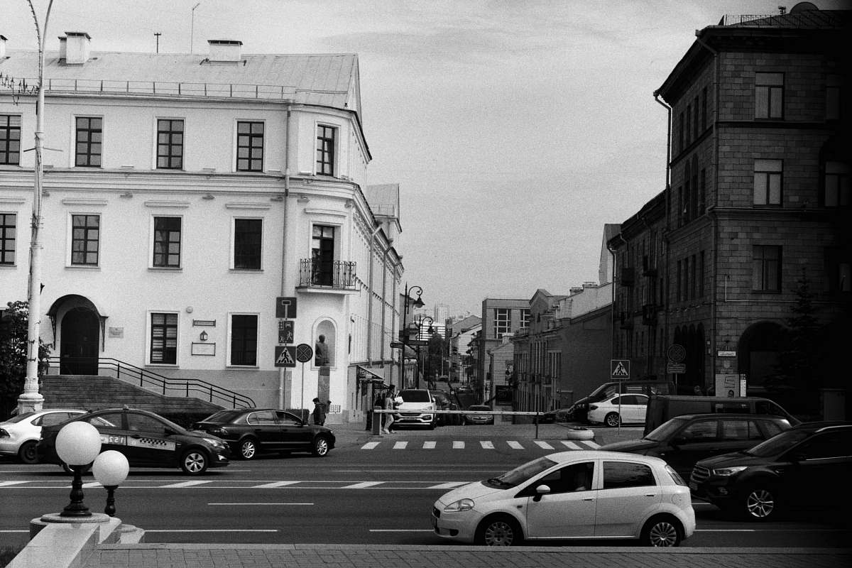 automobile grayscale photography of vehicle passing on road car