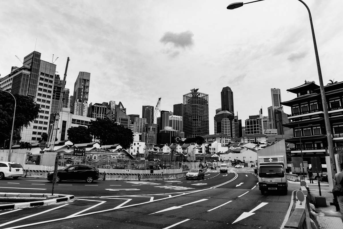road grayscale photography of vehicles on road asphalt