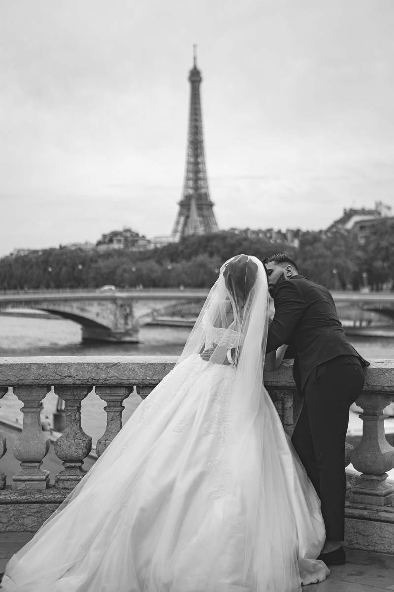apparel grayscale photography of wedding couple in front of Eiffel Tower clothing
