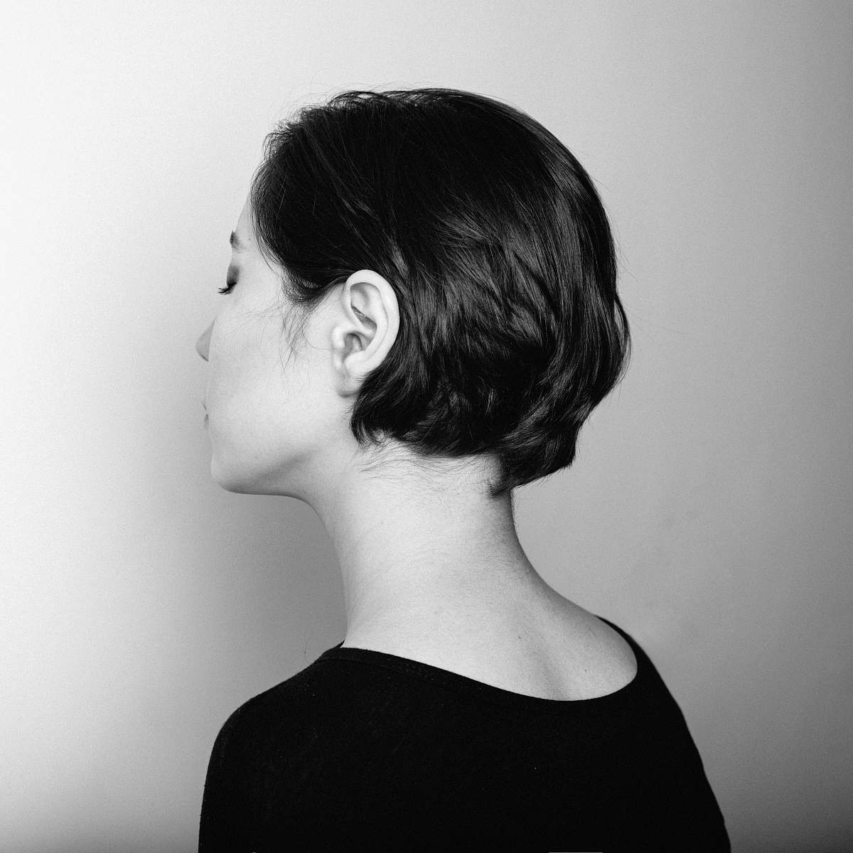 human grayscale photography of woman facing her right side person