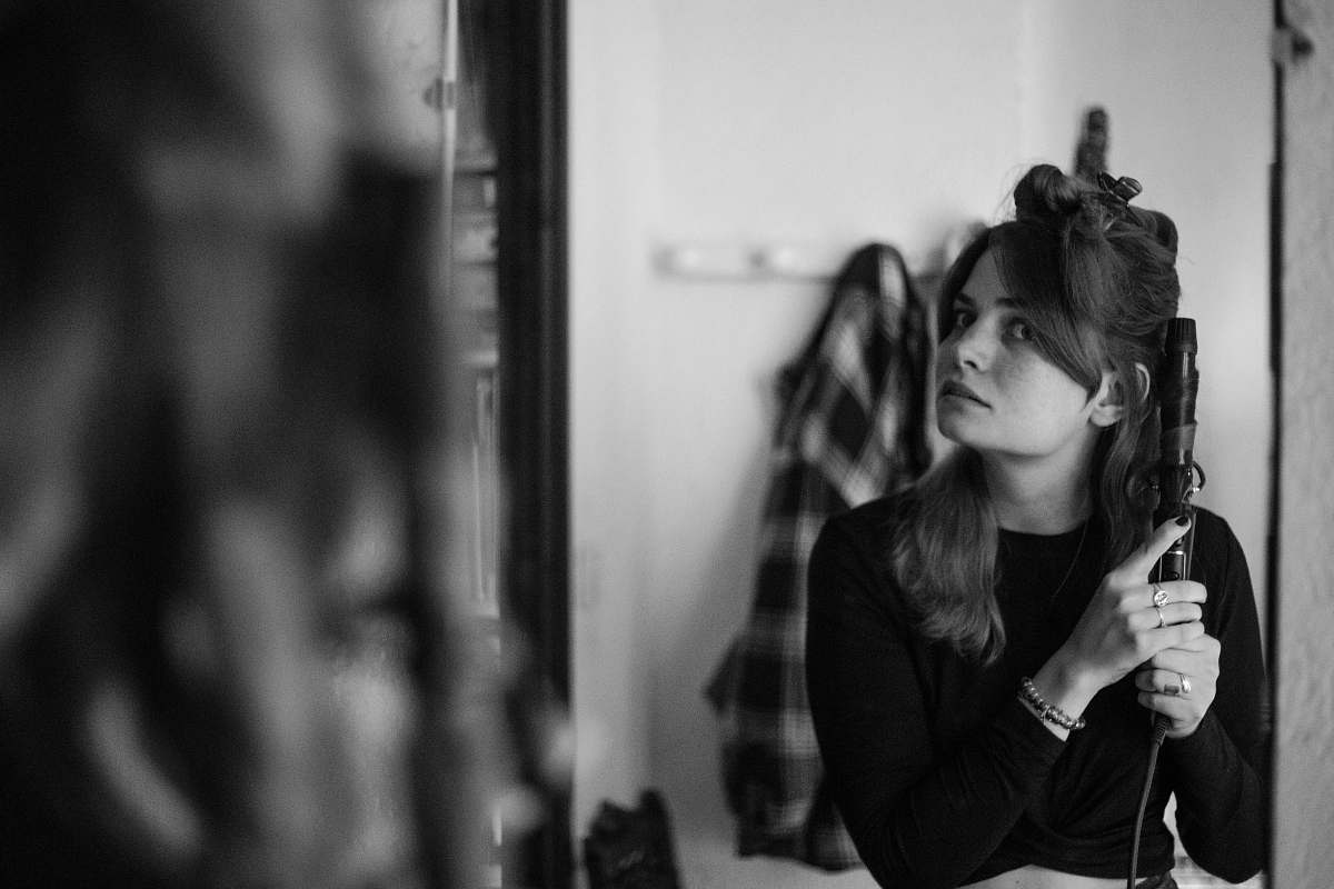 people grayscale photography of woman in long-sleeved top person
