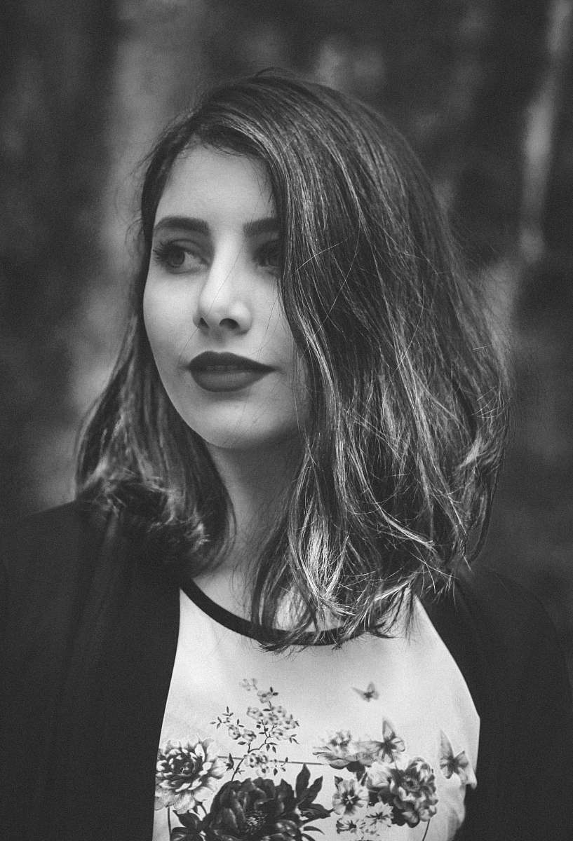 grey grayscale photography of woman wearing cardigan people