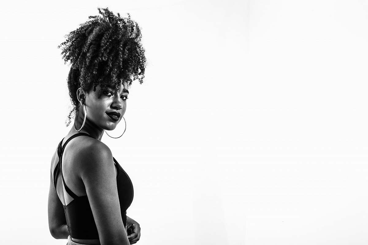 human grayscale photography of woman wearing sports bra person