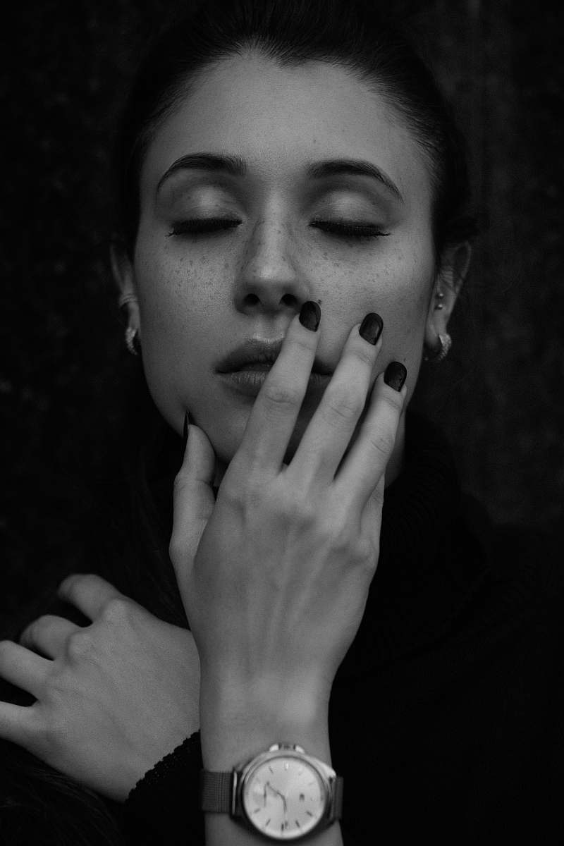 person grayscale portrait photo of a woman wristwatch