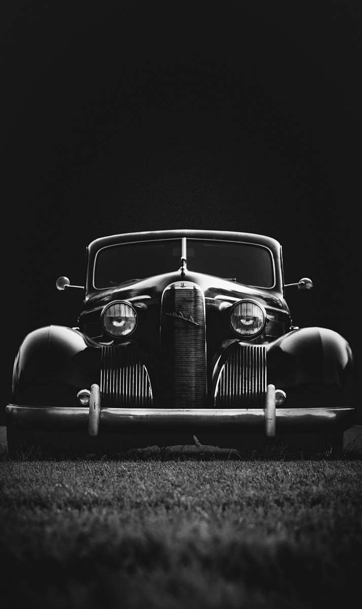 car greyscale photo of classic vehicle on ground vehicle