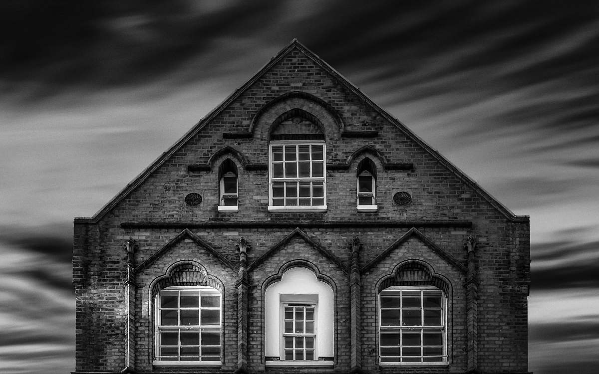 house greyscale photo of house brick