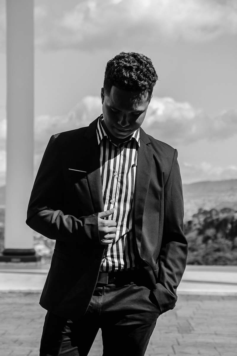 apparel greyscale photo of man wearing tuxedo clothing