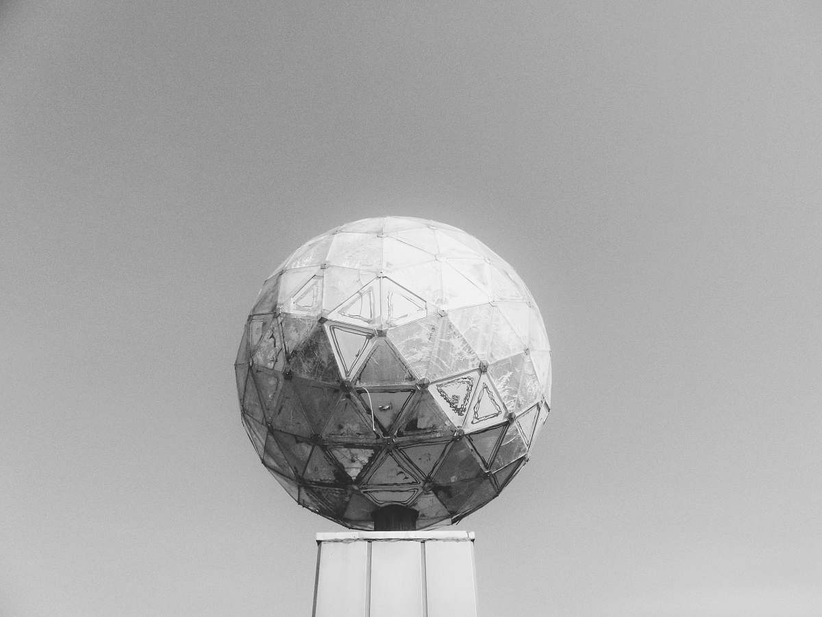 grey greyscale photo of round infrastructure sculpture
